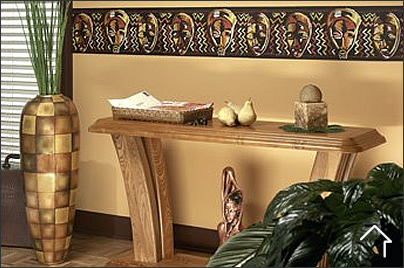 Sala de estar con decoración étnica, tonos tierra, máscaras de madera y cojines con estampados geométricos